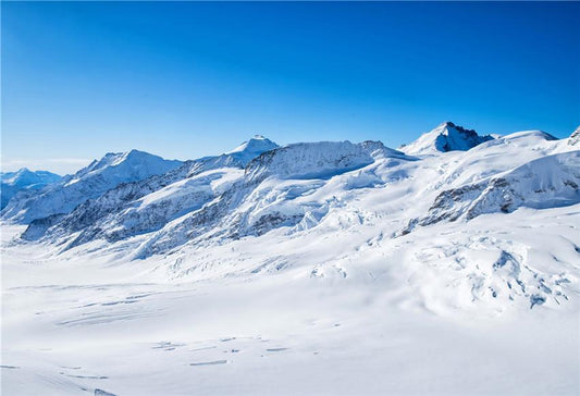 Toile de fond de photo de montagne de neige de ciel bleu d'hiver
