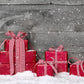 Toile de fond de photographie de cadeau de Noël rouge fond de mur en bois