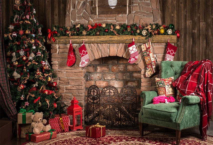Toile de fond de brique cheminée chaussettes sofa vert joyeux Noël